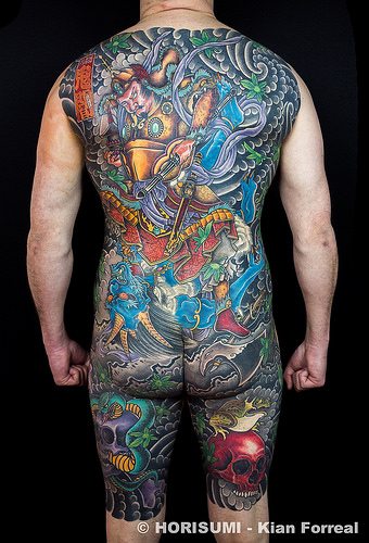 traditional back piece tattoo