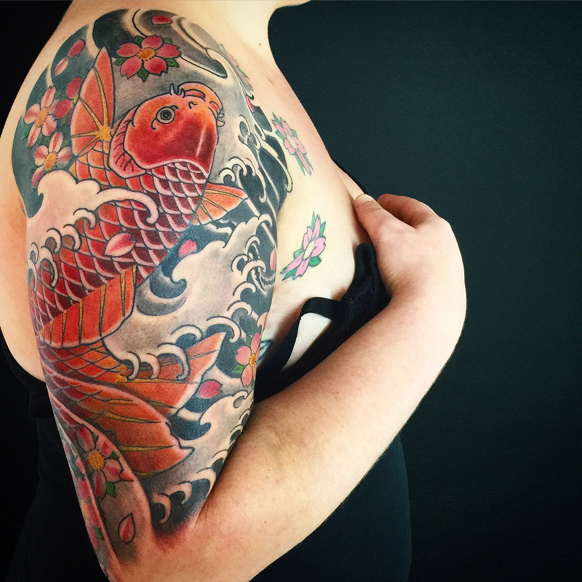 Koi fish tattoo on chest by Ren Sommers TattooNOW