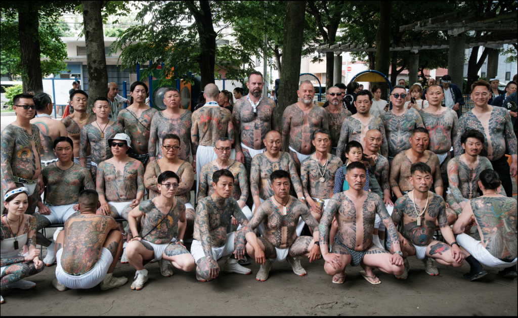 large group shot of tattooed irezumi yakuza group