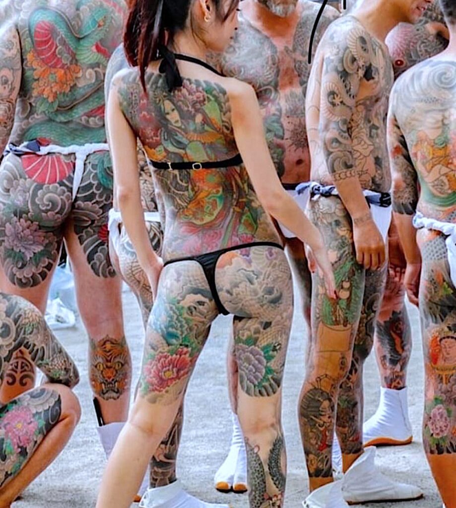 sexy irezumi woman in tattooed group